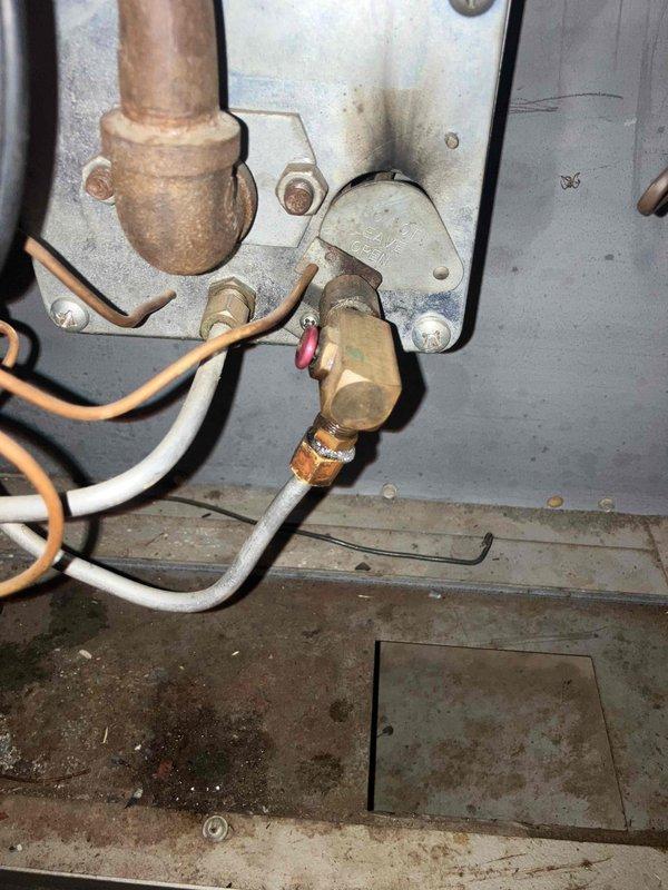 Responded to gas leak emergency at furnace location. Upon arrival, gas supply had been shut off by homeowner. Inspection confirmed active leak at standing pilot supply line connection. Removed defective standing pilot assembly and associated tubing. Installed replacement components, pressure tested all gas connections for leaks, restored gas supply, and verified proper system operation. Unit returned to safe working condition.