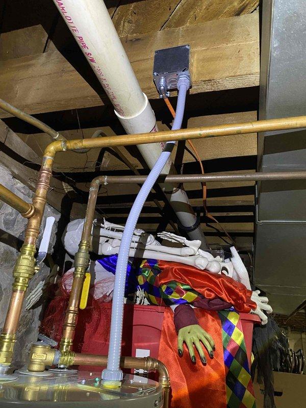 Supplied and installed a 50-gallon electric Bradford White water heater. Connected electrical wiring to unit terminals with proper hot wire configuration and verified scald hazard warning labels were visible per safety requirements. Installed copper supply lines with brass compression fittings and integrated existing plumbing infrastructure including PVC drain lines to complete the installation.
