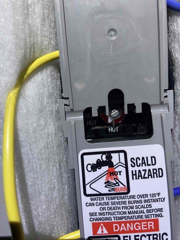 Supplied and installed a 50-gallon electric Bradford White water heater. Connected electrical wiring to unit terminals with proper hot wire configuration and verified scald hazard warning labels were visible per safety requirements. Installed copper supply lines with brass compression fittings and integrated existing plumbing infrastructure including PVC drain lines to complete the installation.
