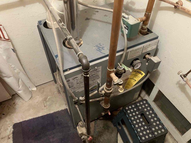 Responded to no heat and no hot water call at residential property. Upon inspection, diagnosed failed primary circulator pump on boiler system preventing proper water circulation through heating system. Removed defective pump and installed replacement unit, restoring full functionality to both domestic hot water and space heating. System tested and verified operational upon completion.