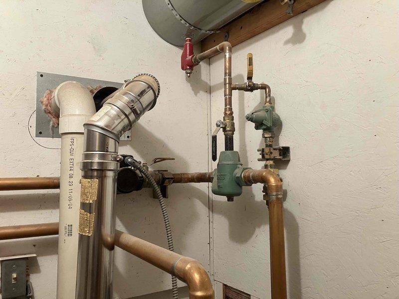 Responded to no heat and no hot water call at residential property. Upon inspection, diagnosed failed primary circulator pump on boiler system preventing proper water circulation through heating system. Removed defective pump and installed replacement unit, restoring full functionality to both domestic hot water and space heating. System tested and verified operational upon completion.