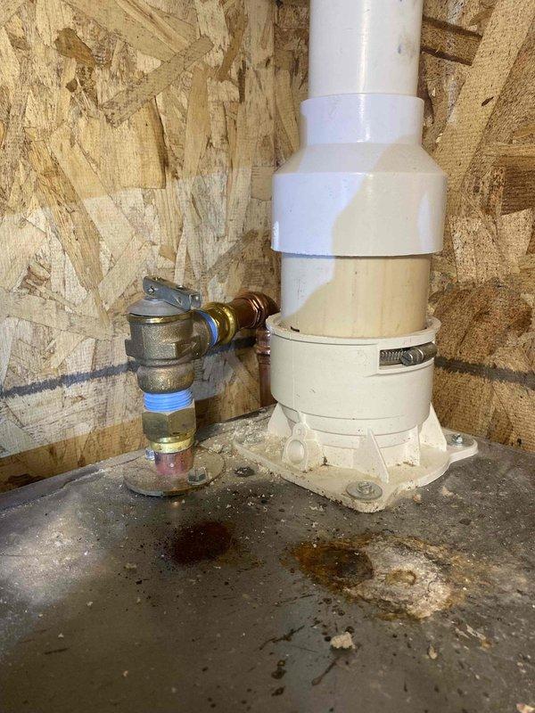 Performed comprehensive boiler and indirect water heater system repairs to bring installation into code compliance and improve serviceability. Added 3/4" black iron drip leg with union to boiler gas line, shortened flexible gas connector and relocated shutoff valve for proper configuration. Removed non-compliant PVC temperature and pressure relief discharge piping from both boiler and indirect water heater, replaced with code-compliant materials. Installed 1" thermostatic mixing valve on domestic hot water system with isolation valves on cold inlet and hot outlet, reconfigured recirculation line to circulate tempered water instead of drawing directly from indirect tank. Removed leaking 1" connection at boiler base and installed isolation valves with drain ports to allow future servicing without full system drain. Replaced corroded air vent on air separator. Added Fernox Protector F1 corrosion inhibitor to heating system. Refilled boiler, purged all air from system, tested heating and d