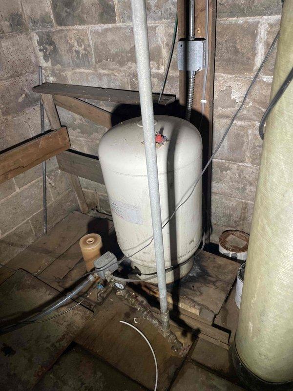 Completed annual inspection on water heater, which was found to be in good working condition. Identified pressure tank dated from 1993 showing significant age-related wear and recommended replacement. Generated estimate for pressure tank replacement to ensure continued system reliability.