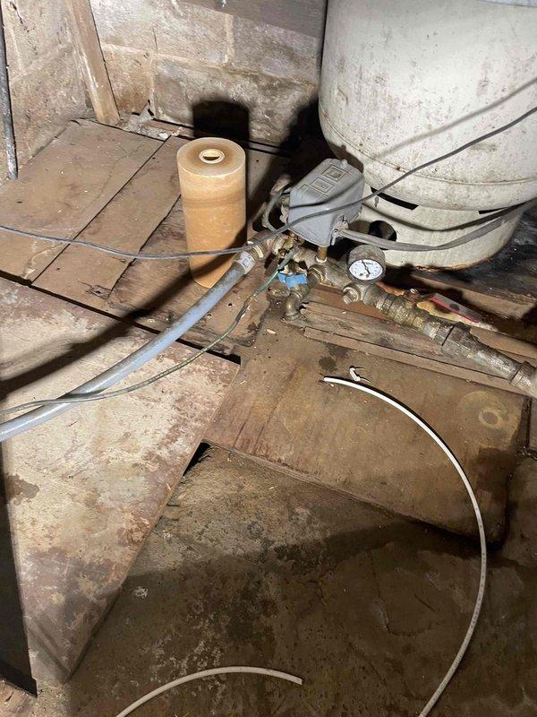 Completed annual inspection on water heater, which was found to be in good working condition. Identified pressure tank dated from 1993 showing significant age-related wear and recommended replacement. Generated estimate for pressure tank replacement to ensure continued system reliability.