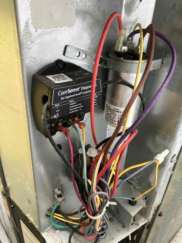 Completed annual prepaid maintenance on air conditioning system. Found and replaced dirty air filter. Inspected blower motor assembly and electrical components including CoreSense diagnostic module for Copeland scroll compressor and capacitor. All wiring connections verified secure and system operating within normal parameters.