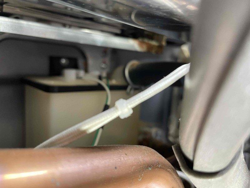 Completed annual prepaid plumbing inspection on tankless water heater system. During inspection, identified corrosion developing on secondary heat exchanger components, documented condition with photographs of affected parts including filter assembly and internal exchanger elements. Customer was informed of findings and current equipment condition for future maintenance planning.