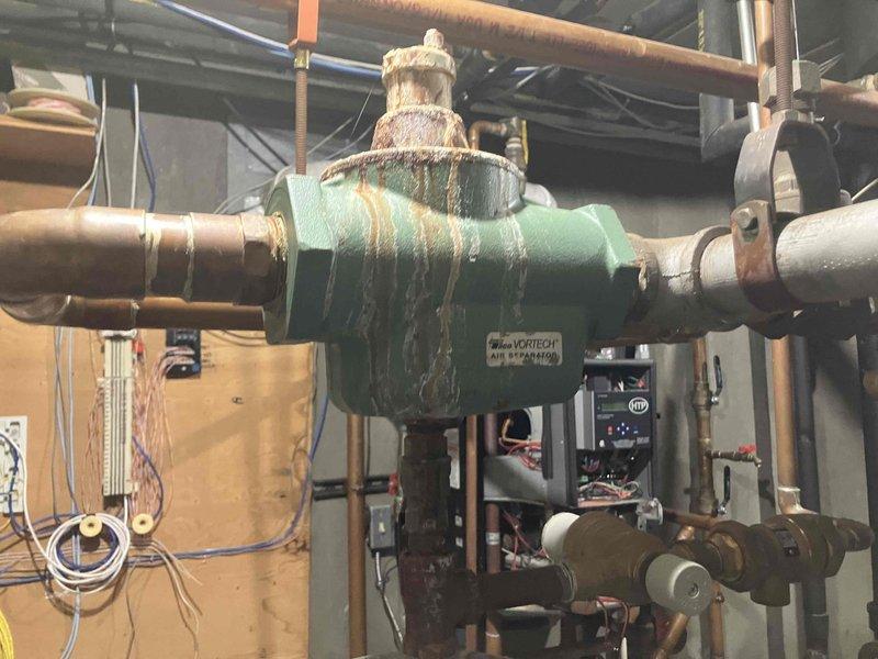 Responded to no heat call on 12-year-old HTP Elite FT boiler system with zoned heating distribution. Upon inspection, diagnosed multiple system failures including failing circulation pumps preventing heat distribution to upper floors, deteriorated air separator with extensive rust and corrosion compromising system efficiency, and failed pressure gauge requiring replacement. Provided three separate repair estimates to address the identified equipment failures and restore proper heating operation to the multi-zone hydronic system.