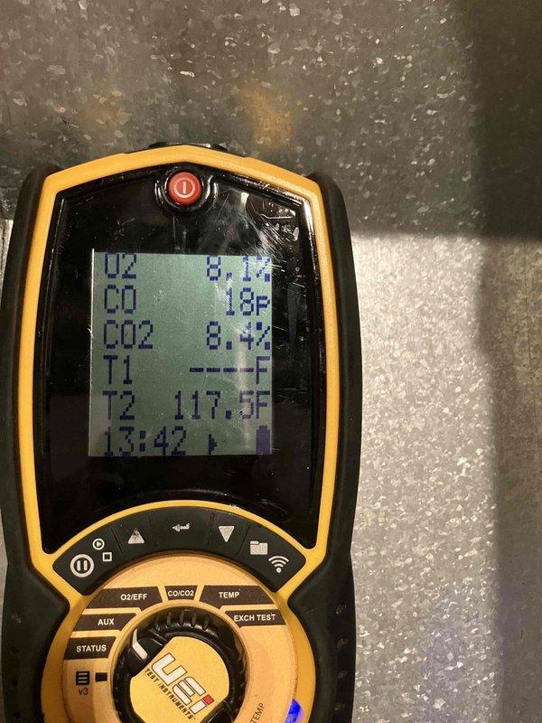 Completed comprehensive heat inspection as part of prepaid maintenance plan. Performed combustion analysis using digital analyzer, recording oxygen levels, carbon monoxide at 18°F, carbon dioxide at 8.4%, and temperature readings including T2 at 117.3°F. Inspected blower wheel assembly and housing, noting normal dust accumulation on blades and interior surfaces with all components properly secured and functional.