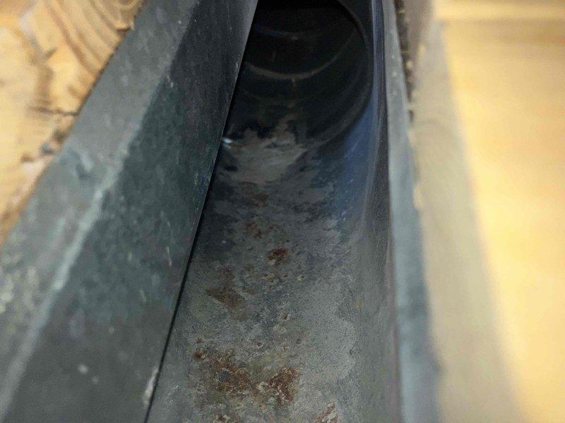 Completed comprehensive duct cleaning service for residential HVAC system. Removed accumulated dust, debris, and granular material from metal ductwork, including significant buildup observed at duct openings and interior surfaces. Addressed visible rust patches and deterioration within rectangular supply ducts and circular return air channels to restore proper airflow and improve indoor air quality.