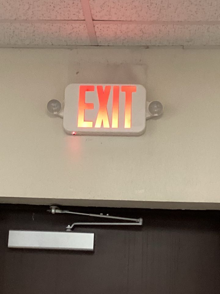 Replace the exit sign and connect the battery pack on the emergency light 