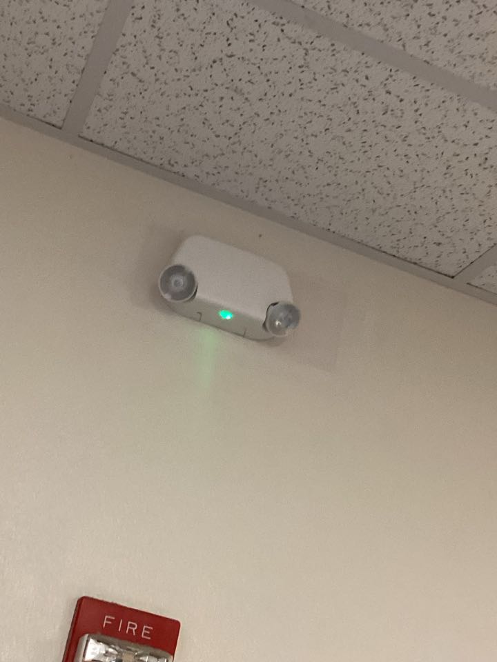 Replace the exit sign and connect the battery pack on the emergency light 