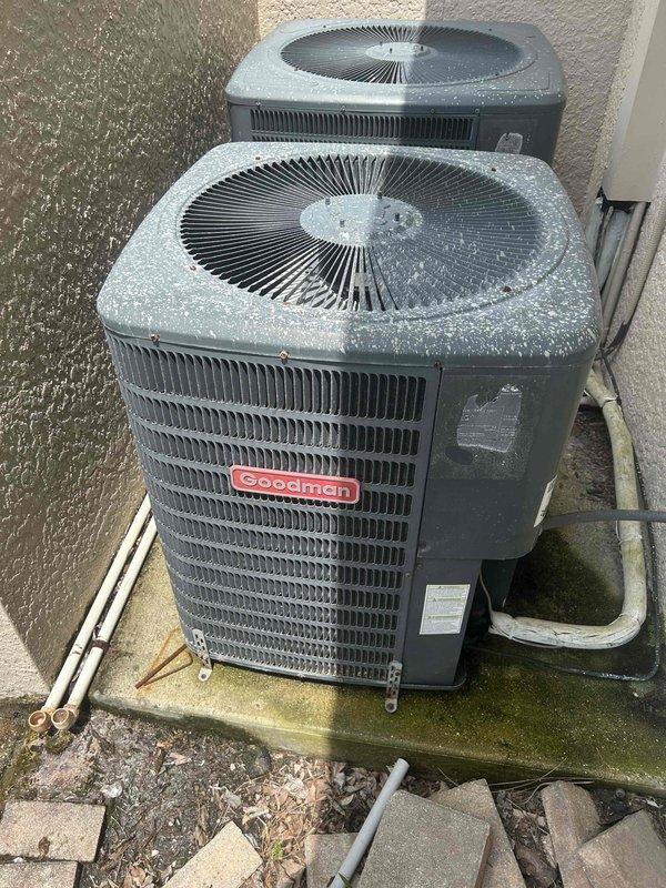 Completed full system estimate for dual HVAC installation consisting of 3-ton and 2.5-ton Goodman units. Assessed electrical panel capacity and verified adequate breaker configuration to support both condensing units, with existing Square D breakers rated appropriately for the installation. Evaluated exterior installation site where both Goodman condensing units are positioned on concrete pads against building exterior wall. Documented existing refrigerant line sets, PVC condensate drainage, and electrical conduit routing. Photographed equipment placement, electrical infrastructure, and site conditions to provide comprehensive documentation for proposed system installation.