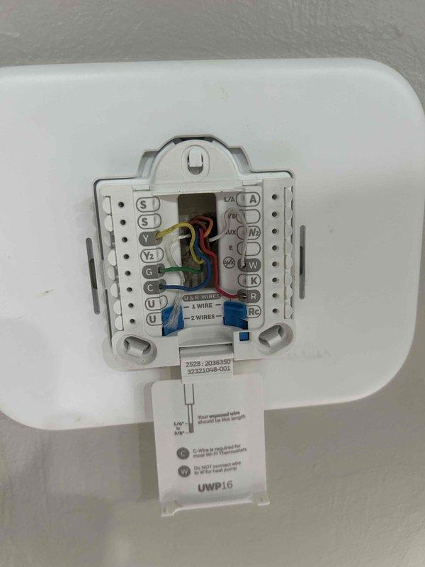 Responded to service call for non-functioning thermostat. Upon arrival, inspected HVAC control panel and thermostat wiring connections. Documented existing wire terminations at both the air handler control board and wall-mounted thermostat, verifying proper connections for R, C, Y, Y2, G, O/B, W, W2, and auxiliary terminals. All wiring found secure with no loose connections or damaged conductors. System restored to normal operation.