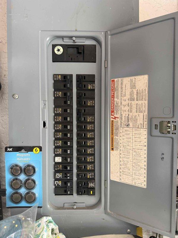 Cape Coral, FL - Conducted comprehensive electrical system assessment for full system replacement estimate. Inspected existing Square D electrical panel with multiple circuit breakers, documented current panel configuration including main breaker and GFCI protection, and photographed circuit directory with existing wiring notations. Evaluated overall system capacity, breaker conditions, and panel enclosure to provide accurate specifications for complete electrical system upgrade recommendations.
