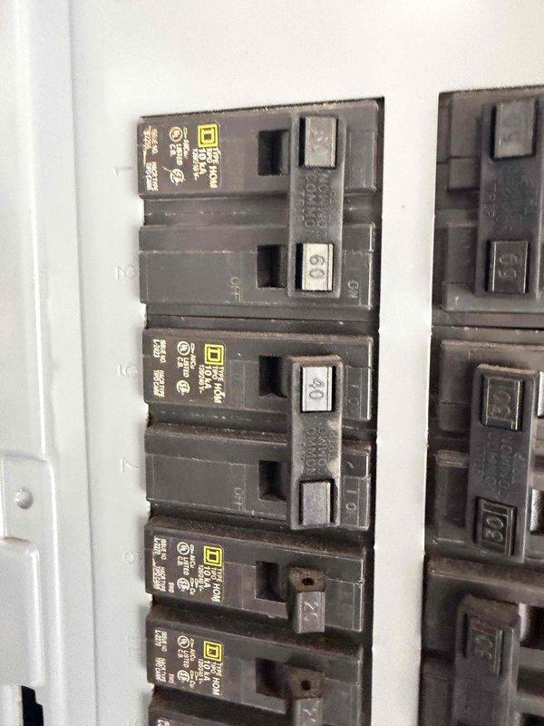 Cape Coral, FL - Conducted comprehensive electrical system assessment for full system replacement estimate. Inspected existing Square D electrical panel with multiple circuit breakers, documented current panel configuration including main breaker and GFCI protection, and photographed circuit directory with existing wiring notations. Evaluated overall system capacity, breaker conditions, and panel enclosure to provide accurate specifications for complete electrical system upgrade recommendations.
