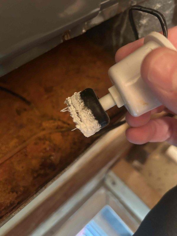 North Fort Myers, FL - Responded to no cooling complaint on residential HVAC system. Upon inspection, discovered electrical plug connector with heavy crystalline buildup and corrosion on metal prongs, preventing proper electrical connection. Cleaned and serviced electrical connection point to restore power to unit. System tested and confirmed operational after resolving power supply issue.