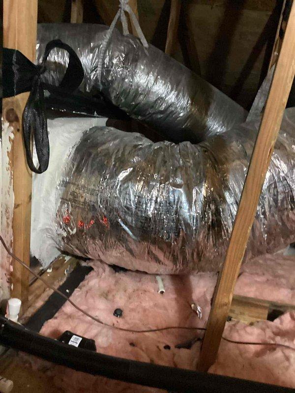 Naples, FL - Completed routine maintenance inspection as part of a scheduled preventive maintenance agreement visit (3 of 4). Serviced dual outdoor HVAC condensing units located in landscaped side yard area and inspected associated ductwork system in attic space. Verified proper operation of both air conditioning units, checked refrigerant levels, cleaned condenser coils, and inspected electrical connections. Examined flexible duct runs in attic crawl space for proper insulation integrity, secure fastening, and absence of air leaks. All systems found operating within normal parameters with no immediate repairs required.