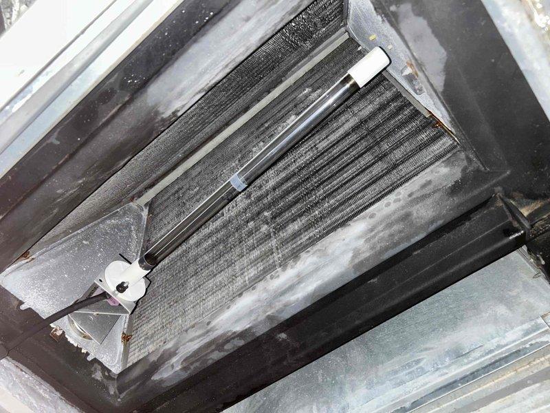 Fort Myers, FL - Responded to no cooling call and performed system inspection. Documented evaporator coil condition showing dust accumulation on fins and verified refrigerant line connections with securing clips in place. Inspected blower motor assembly and electrical connections including ground wire and power wiring. Coordinated with property owner per request before proceeding with diagnostic work, discussed potential refrigerant leak testing as next step to identify root cause of cooling issue.