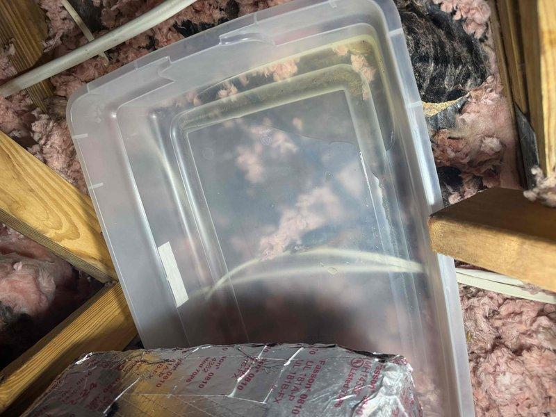 North Fort Myers, FL - Responded to service call for water leakage through living room ceiling originating from HVAC equipment in attic space. Upon inspection, discovered multiple unsealed duct joints connected to air handler plenum lacking proper mastic sealant, allowing condensation to escape and saturate ceiling below. Documented attic conditions including exposed air handler installation, insulation placement, and compromised duct connections. Inspected exterior condensing unit and confirmed proper operation. Identified improper duct sealing as primary cause of moisture intrusion and provided recommendations for remediation including application of mastic sealant to all plenum connections and assessment of condensate drainage system to prevent future ceiling damage.
