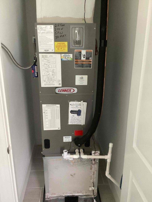 # 2 Year Catalyst Membership Maintenance Completed

Performed comprehensive preventive maintenance inspection on a residential split HVAC system consisting of a Lennox 2.5-ton air handler and outdoor condensing unit. Conducted thorough visual assessment of both indoor and outdoor components as part of scheduled maintenance agreement service visit (1 of 4).

Inspected outdoor condenser unit positioned on concrete pad against building exterior. Verified proper unit placement and mounting stability. Examined cabinet condition, noting weathered finish consistent with outdoor exposure. Checked electrical connections including conduit routing and junction box mounting. Inspected refrigerant line connections and insulation condition at unit entry points. Verified manufacturer labels and equipment identification tags remained legible and intact.

Evaluated indoor Lennox air handler installation in mechanical closet. Confirmed unit specifications marked as 2.5-ton capacity system. Inspected all