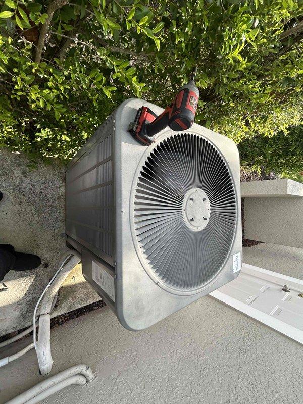 Miromar Lakes, FL - Completed preventive maintenance inspection on residential HVAC system as part of 2 Year Catalyst Membership agreement. Performed comprehensive evaluation of outdoor condenser unit and indoor air handler, documenting equipment condition through photographic records. Inspection revealed significant dust and debris accumulation on blower motor assembly and internal components, indicating need for cleaning during future service visit. Verified refrigerant line connections, assessed condenser fan operation, and examined electrical connections throughout system. All major components found operational at time of inspection, with equipment running within normal parameters despite visible dirt buildup on blower housing and interior surfaces.