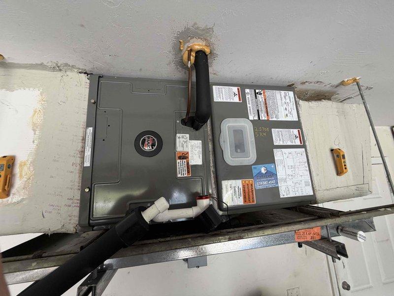 Cape Coral, FL - Completed routine maintenance inspection on attic-mounted HVAC system as the fourth and final service visit under the 2 Year Catalyst Membership program. Performed comprehensive visual assessment of dual air handler configuration, refrigerant line connections, and associated ductwork. Documented existing ceiling moisture staining near refrigerant line penetration and verified proper mounting of equipment on support brackets. Inspected flexible ductwork routing through attic space, insulation condition, and electrical connections. System operational at time of service completion. Customer departing at 1pm as scheduled and has enrolled in new membership for continued coverage.