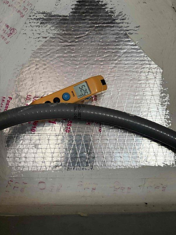 LaBelle, FL - Completed second quarterly preventive maintenance inspection on residential HVAC air handler system. Performed comprehensive system evaluation including visual inspection of equipment, ductwork, and internal components. Documented significant condensation accumulation on supply ductwork indicating proper system cooling operation. Verified temperature differential readings at 52.5 degrees, confirming adequate system performance. Inspected control board, electrical connections, and refrigerant lines. Photographed equipment condition and insulation integrity for maintenance records.