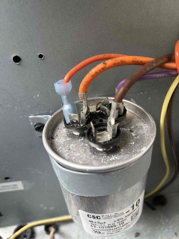 Completed routine preventive maintenance inspection on HVAC air handler unit as part of scheduled maintenance agreement. Inspected A-frame evaporator coil assembly, confirmed coils in clean operational condition with proper fin spacing and metallic integrity intact. Examined drain pan for proper drainage and noted typical operational wear with minor discoloration. Evaluated electrical components including capacitor assembly, verified wire connections and terminal integrity, observed signs of carbon buildup on terminals indicating potential future service needs. Documented system conditions through photographic records for maintenance history tracking.