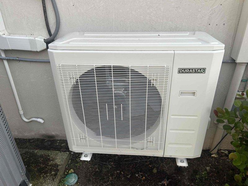 Ave Maria, FL - Responded to service call for HVAC system in garage with reduced airflow. Upon inspection, found Durastar outdoor condensing unit with significant debris accumulation on internal components affecting system performance. Cleaned condenser coils and removed buildup from blower assembly to restore proper air circulation and cooling capacity.
