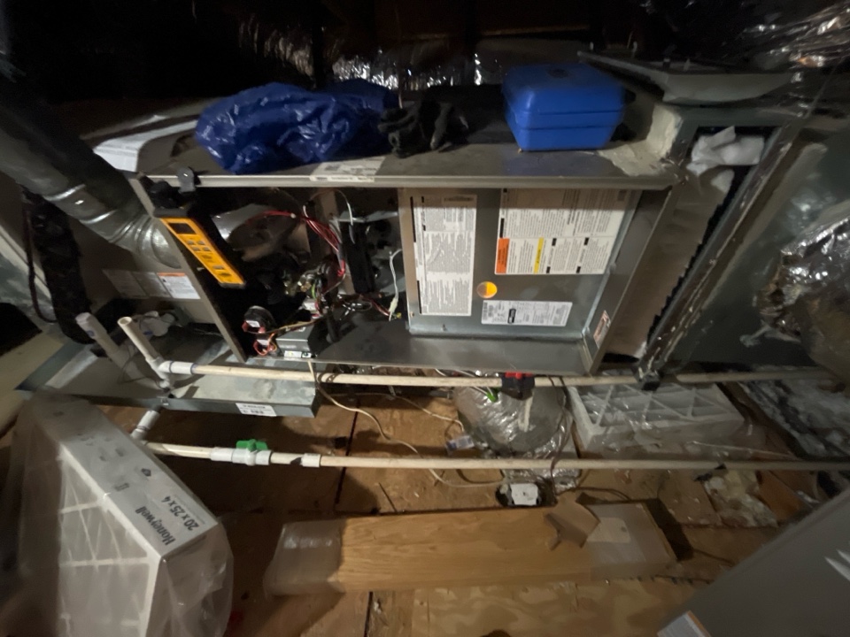 Doing a maintenance on two carrier furnace systems 