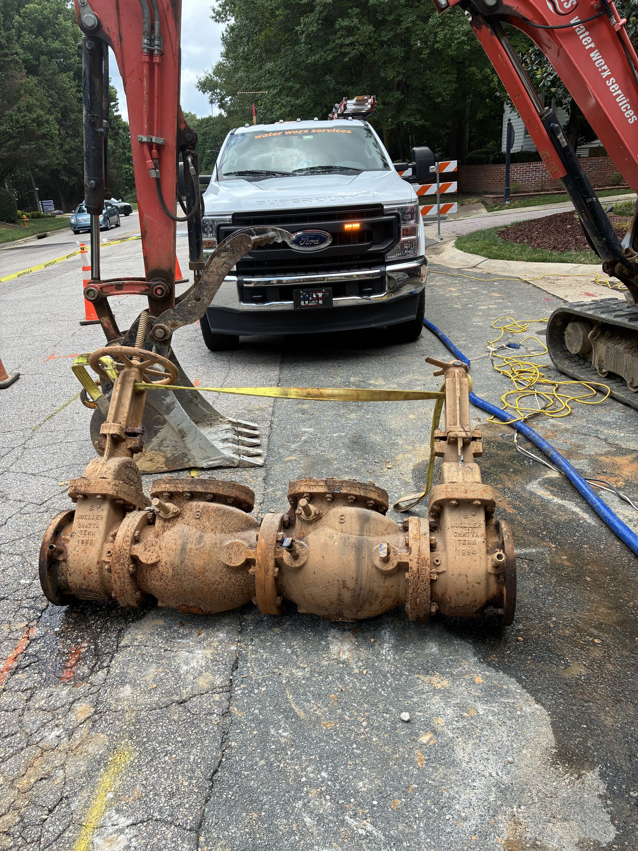 Neighborhood went from private water to municipal water. Removed the old Backflow valve and re piped it with ductile iron pipe. Backfilled once completed 