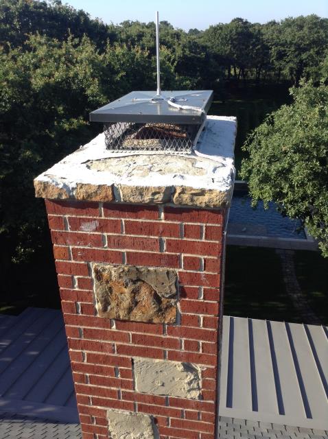 Completing a chimney inspection and sweep to make sure the fireplace is up to code