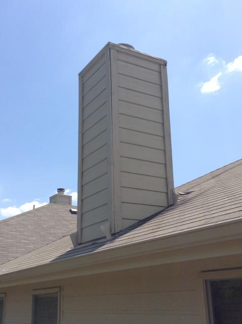 Giving an estimate to replace or repair trim on the chimney chase cover