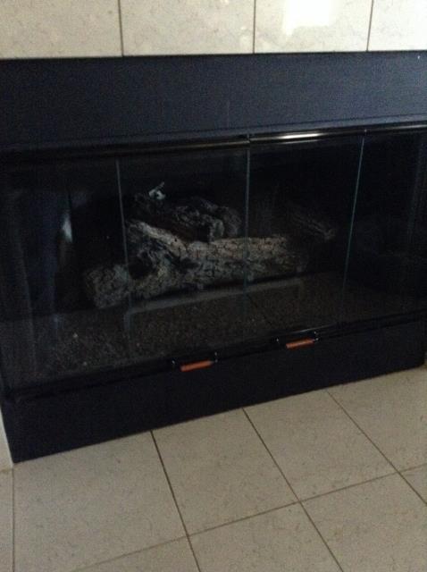 Performing a complete chimney inspection and sweep to make sure fireplace is up to code