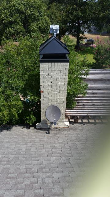 Performing a crown coat, waterproofing and installing a custom chimney cap