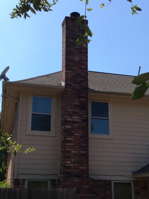 Installing a chimney chase cover and water proofing the chimney.