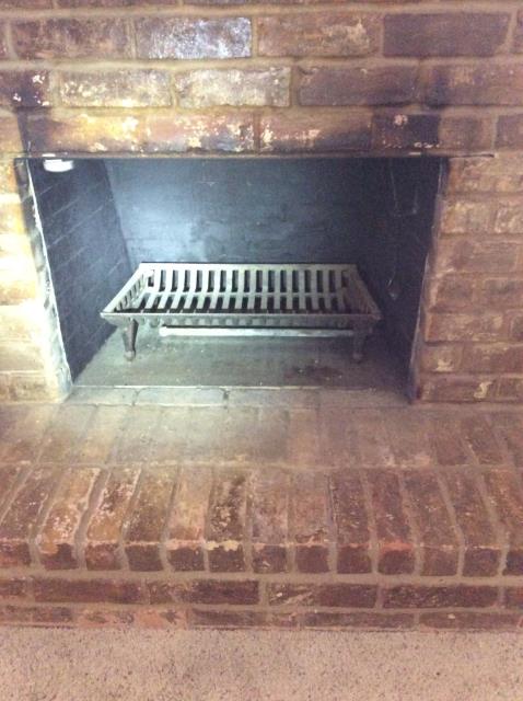 Performing a full chimney inspection to make sure the chimney is up to code.