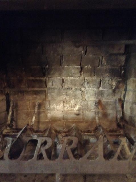 Performing a full chimney inspection to determine why bricks are loose & falling.