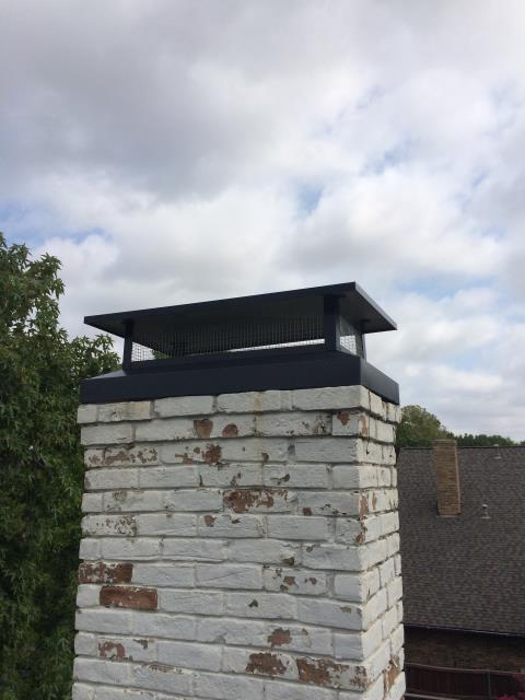 Installed #1 cap, did a flash and seal, crown coat, tuck point on the inside, and refurbished gas logs.