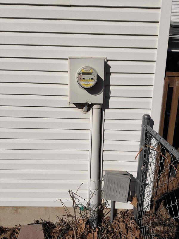 Conducted a comprehensive electrical inspection of the residential property, focusing on the main utility meter installation. Documented existing meter setup mounted on exterior vinyl siding, including verification of the digital display functionality and examination of the associated junction box. No immediate electrical hazards were identified during the assessment.