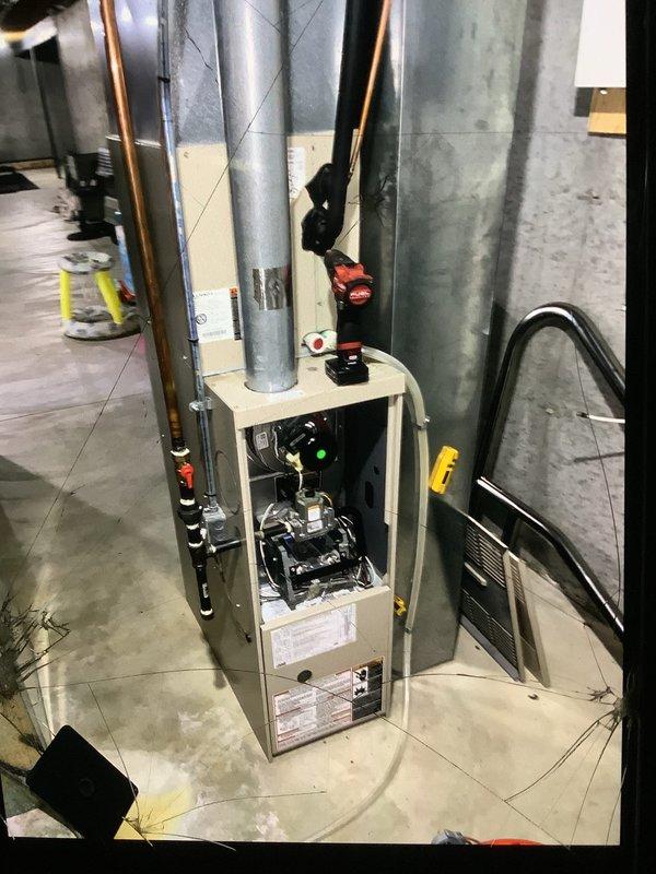 Performed scheduled tune-up service on two 12-year-old furnace units located in basement. Inspected internal components including inducer motor, gas valve assembly, and circuit board. Service included opening access panels, examining wiring connections, and ensuring proper operation of all mechanical systems.