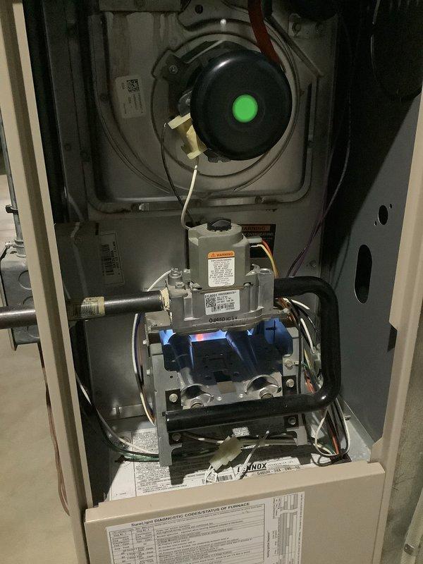 Performed scheduled tune-up service on two 12-year-old furnace units located in basement. Inspected internal components including inducer motor, gas valve assembly, and circuit board. Service included opening access panels, examining wiring connections, and ensuring proper operation of all mechanical systems.