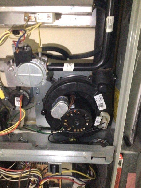 Diagnosed and serviced 14-year-old Trane furnace that had stopped running overnight. Upon inspection of the blower motor assembly, determined the motor had failed, causing system to shut down completely. Replaced defective motor, tested system operation through multiple heating cycles, and confirmed proper function restored.