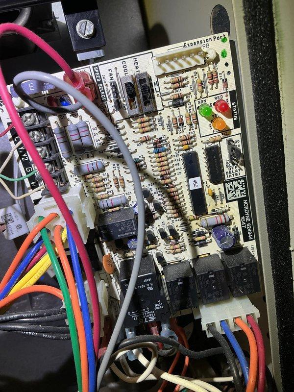 Diagnosed 9-year-old residential furnace with no heat issue; identified faulty expansion port circuit board with compromised electrical connections. Replaced damaged control board and verified proper system operation, restoring heat function to the unit.