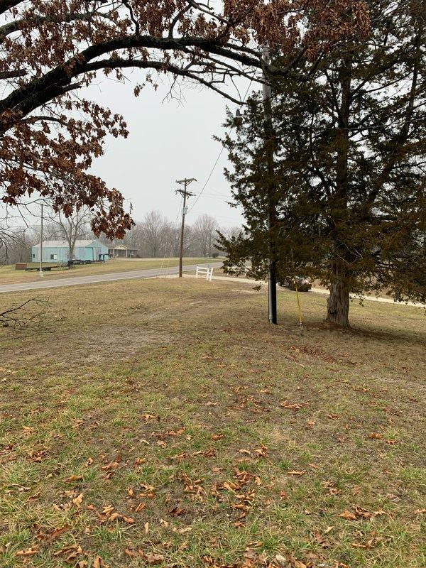 Conducted preliminary site assessment for installation of approximately 100 feet of underground electrical wiring across rural property. Evaluated terrain conditions and identified optimal cable routing path between utility pole and destination building. Photos documented current site conditions for detailed estimate preparation.