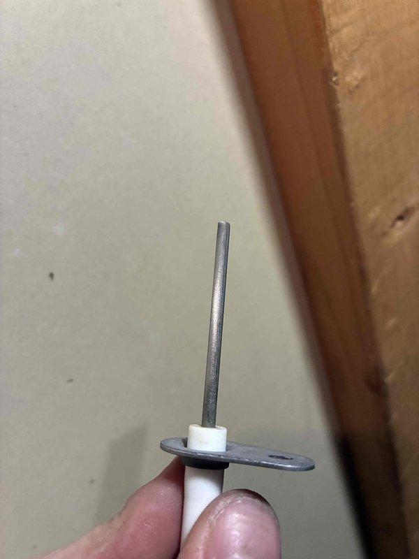 Responded to no heat call for 2021 furnace that was not staying lit. Diagnostic testing with multimeter revealed flame sensor reading of only 0.24 microamps, well below operational threshold. Removed, inspected and cleaned the flame sensor assembly, restoring proper ignition sequence and heat output.