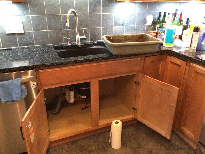 Responded to service call for slow-draining kitchen sink. Performed inspection of the drain system and accessible plumbing components under sink. Successfully cleared blockage and verified proper drainage functionality before completing service.