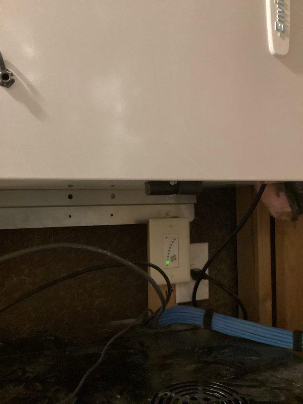 Responded to service call following customer-reported power surge to inspect 2-year-old geothermal system. Performed comprehensive inspection of internal components including control board and electrical connections, confirming all indicator lights showing normal operation. Verified thermostat functionality with proper heating mode engagement at 68° setpoint.