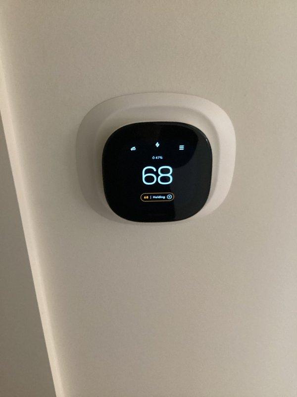 Responded to service call following customer-reported power surge to inspect 2-year-old geothermal system. Performed comprehensive inspection of internal components including control board and electrical connections, confirming all indicator lights showing normal operation. Verified thermostat functionality with proper heating mode engagement at 68° setpoint.