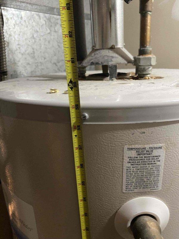 Installed new 50-gallon gas tall water heater in basement location, replacing existing unit. Properly connected copper supply lines and gas piping, verified pressure readings on PROFLO gauge were within acceptable parameters, and installed temperature-pressure relief valve assembly per code requirements. Installation completed successfully with all connections tested for leaks and proper operation.